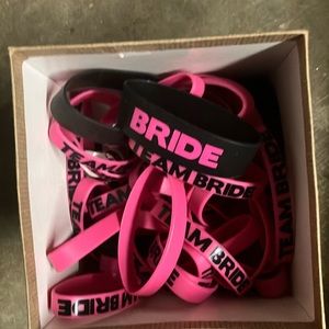 Box full of Rubber Bracelets That Say “BRIDE” & “TEAM BRIDE”